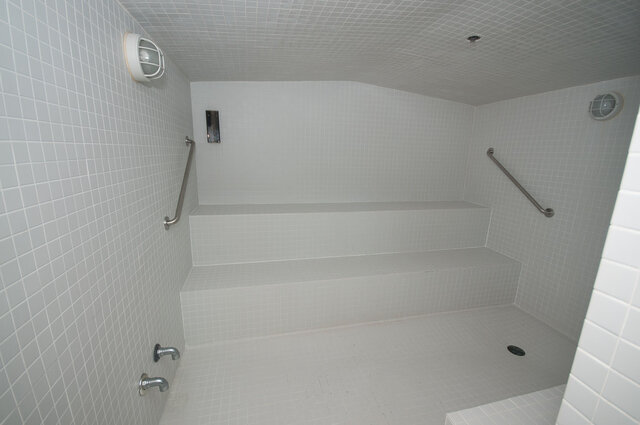 Spacious bathroom with tiled walls and built-in bench seating. - 706-499 Broughton, Vancouver Downtown
