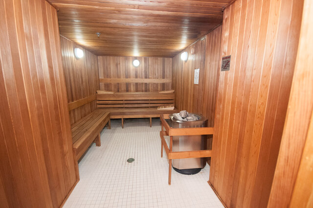 Spacious, cozy sauna with wooden benches and tiled floor. - 706-499 Broughton, Vancouver Downtown