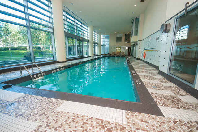 Spacious indoor pool with mosaic tile flooring and large windows. - 706-499 Broughton, Vancouver Downtown