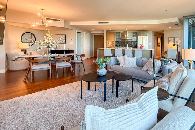 Spacious living room with modern sofa set and polished hardwood flooring. - 3309-1111 Alberni Street, Vancouver Downtown