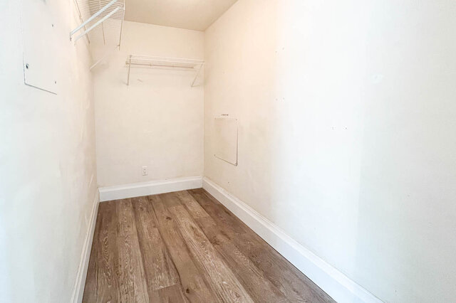 Den with hardwood floors and white walls, featuring a closet with shelving. - 2905-1009 Expo Boulevard, Vancouver Downtown