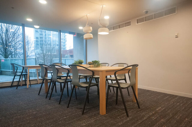 Spacious dining area with large windows, modern lighting, and a city view. - 2905-1009 Expo Boulevard, Vancouver Downtown