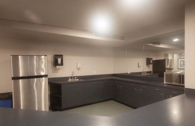 Modern kitchen with sleek black countertops and stainless steel appliances. - 2905-1009 Expo Boulevard, Vancouver Downtown