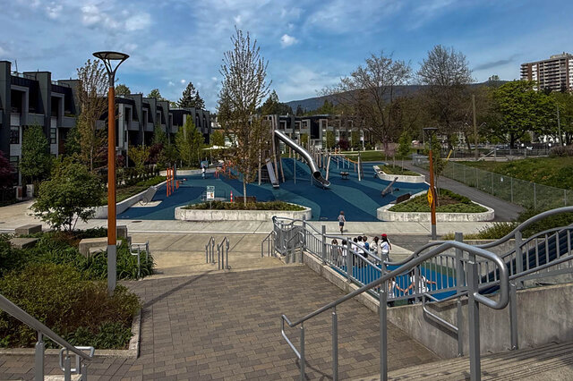 Spacious balcony with tiled flooring and a view of neighboring rooftops. - 210-2060 Curling Road, North Vancouver