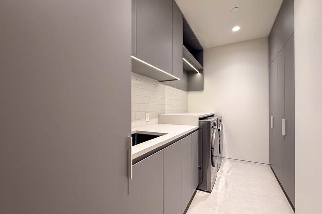 Laundry room with white countertops and under-cabinet lighting. - 2390 Westhill Drive, West Vancouver