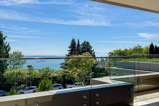Sunny balcony with glass railings and ocean view. - 2390 Westhill Drive, West Vancouver