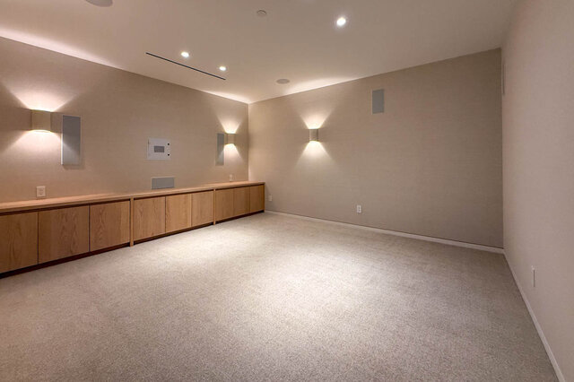 Spacious den with built-in wooden cabinets and recessed lighting. - 2390 Westhill Drive, West Vancouver