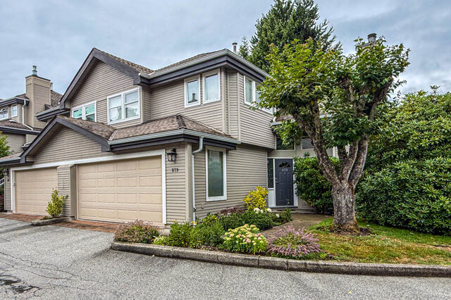 Well-kept garden with flowering shrubs and mature trees. - 879 Roche Point Drive, North Vancouver