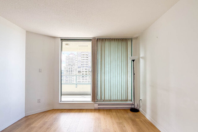 Bright bathroom with warm-toned countertop and tiled flooring. - 1805-4388 Buchanan Street, Burnaby