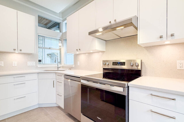 Spacious entryway with hardwood floors and skylights leading to bright living space. - 3443 West 6th Ave, Vancouver West Side