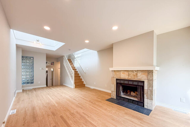 Spacious entryway with glass block wall and light oak hardwood flooring. - 3443 West 6th Ave, Vancouver West Side