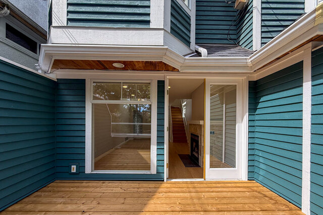 Bright kitchen with white cabinetry and stainless steel appliances. - 3443 West 6th Ave, Vancouver West Side