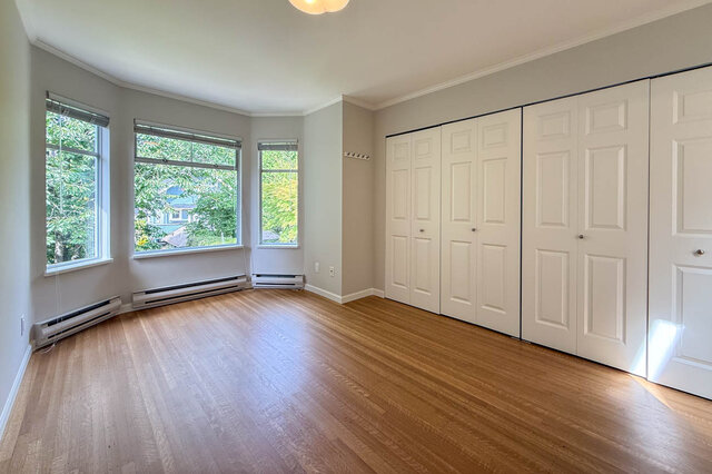 Bright den with hardwood floors and large bay window views of greenery. - 3443 West 6th Ave, Vancouver West Side