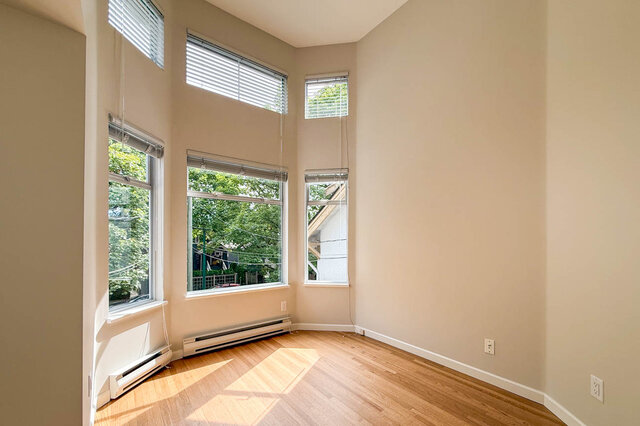 Bright landing with skylight and hardwood floors leading to sunlit rooms. - 3443 West 6th Ave, Vancouver West Side