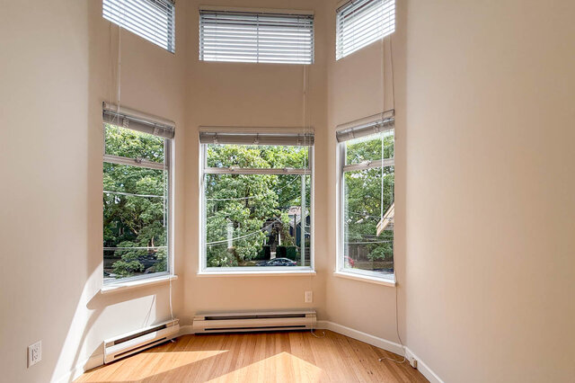 Bright den with hardwood floors and large windows featuring adjustable blinds. - 3443 West 6th Ave, Vancouver West Side