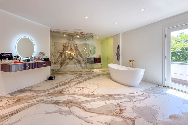 Luxurious bathroom with marble flooring, freestanding tub, and glass shower enclosure - 1249 Chartwell Place, West Vancouver