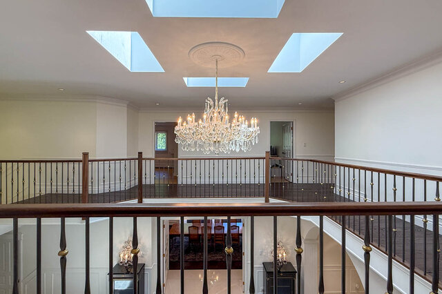 Grand interior space with skylights, crystal chandelier, hardwood floors, and balcony - 1249 Chartwell Place, West Vancouver