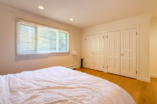 Bright bedroom with hardwood floors, large windows, and walk-in closet - 1249 Chartwell Place, West Vancouver