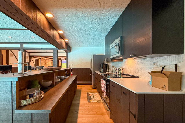 A bright kitchen with stainless appliances and hardwood floors. - 1249 Chartwell Place, West Vancouver