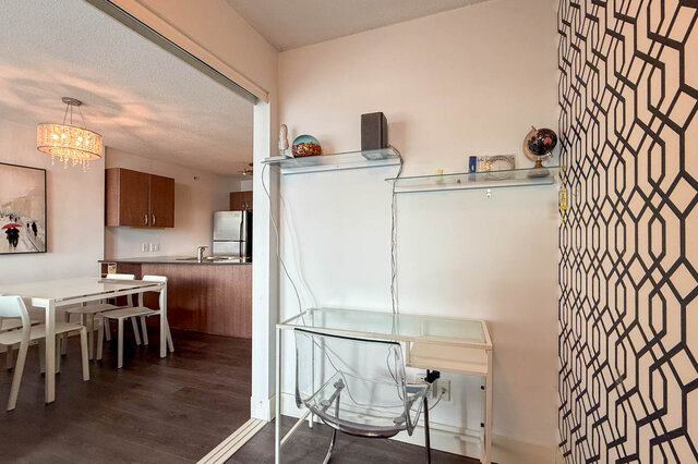 Bright den featuring glass desk and sleek white shelving with modern decor. - 2113-610 Granville Street, Vancouver Downtown
