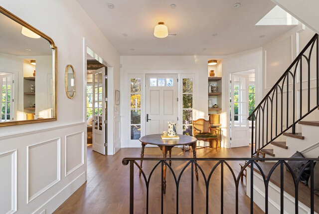 Bright entrance hall with hardwood floors, staircase, and French doors - 1248 Kings Avenue, West Vancouver