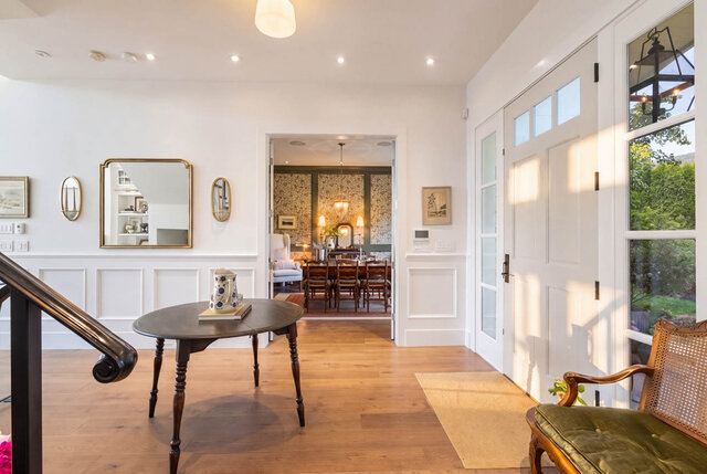 Bright lobby with hardwood floors, large windows, and a staircase leading to the dining area - 1248 Kings Avenue, West Vancouver