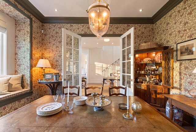 An elegant dining area featuring floral wallpaper, hardwood floors, and French doors. - 1248 Kings Avenue, West Vancouver
