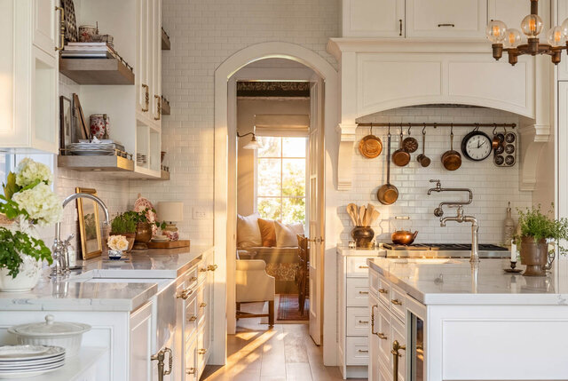 Bright kitchen with white cabinets, subway tile backsplash, and view into sunlit living area - 1248 Kings Avenue, West Vancouver