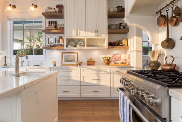 Bright kitchen with white cabinetry and stainless steel appliances. - 1248 Kings Avenue, West Vancouver