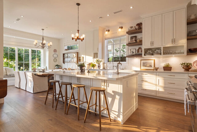 Bright, spacious kitchen with large windows, white cabinetry, and hardwood floors. - 1248 Kings Avenue, West Vancouver