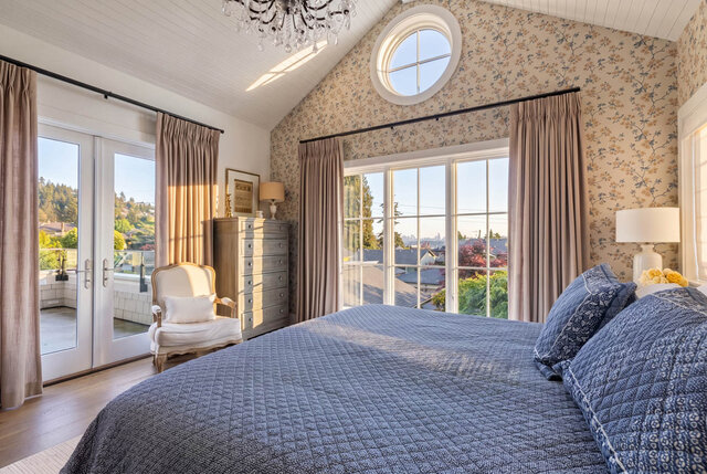 Sunlit bedroom with large windows, floral wallpaper, and a balcony view - 1248 Kings Avenue, West Vancouver