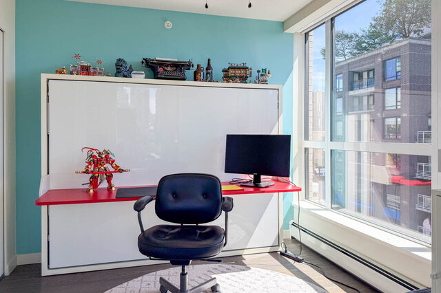 Home office with red desk and city view from large window. - 505-189 Keefer Street, Vancouver Downtown