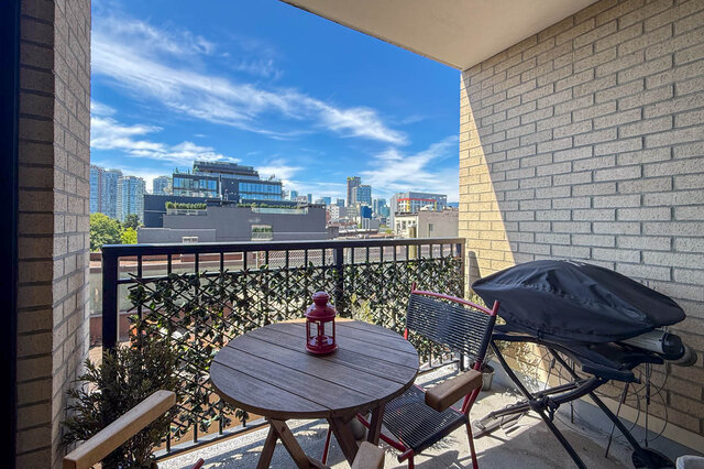 Balcony with downtown city view and wooden table with red lantern. - 505-189 Keefer Street, Vancouver Downtown