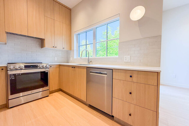 Bright kitchen with light wood cabinets and hardwood floors. - 3038 Vine Street, Vancouver West Side
