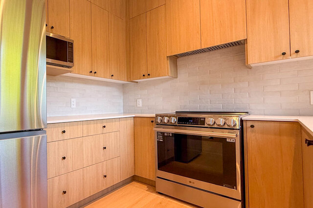 Bright kitchen with light wood cabinets and white tile backsplash. - 3038 Vine Street, Vancouver West Side