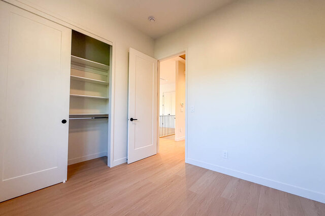 Spacious bedroom with hardwood floors and built-in closet. - 3038 Vine Street, Vancouver West Side