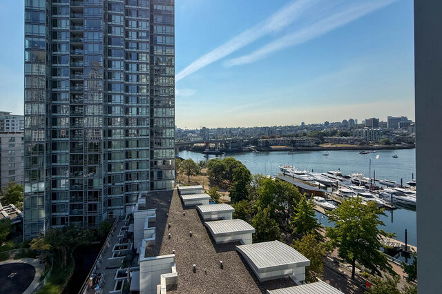 Window view of a marina filled with yachts and a glass high-rise tower across the river. - 1101-1067 Marinaside Crescent, Vancouver Downtown