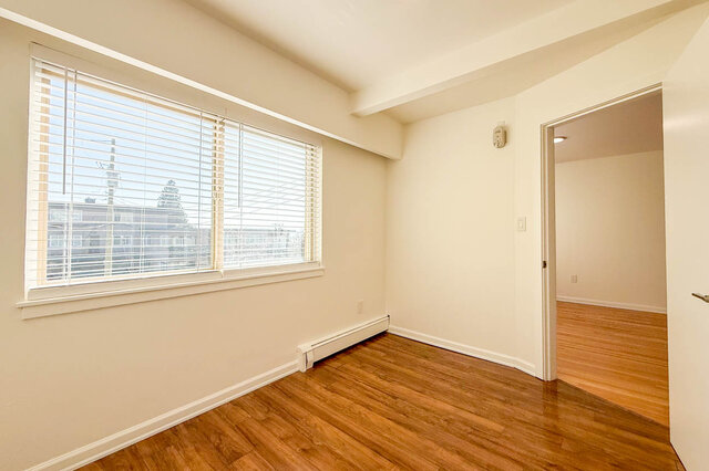The second bedroom's window, with the door out to the living room - 107-461-16th Street West, North Vancouver