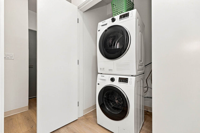 Stacked Samsung washer and dryer in a closet off the hall. - 111-1529 Oxford Street, North Vancouver