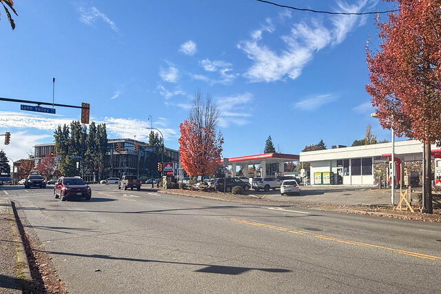 Street corner at Lynn Valley Road with traffic lights, a gas station and autumn trees. - 402-3205 Mountain Highway, North Vancouver