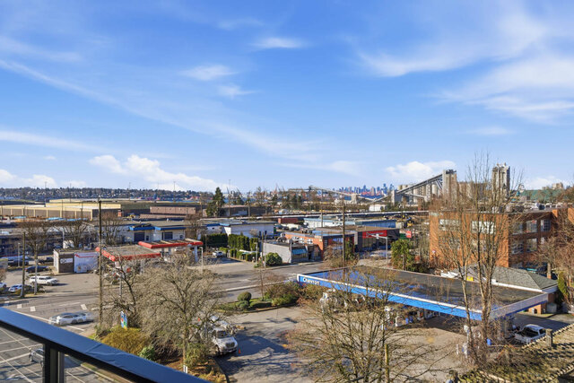 View west over rooftops to the downtown skyline on the horizon. - 619-1529 Oxford Street, North Vancouver