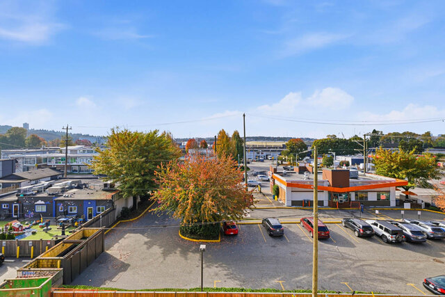 Outlook from the balcony over autumn trees and the neighbourhood. - 409-1529 Oxford Street, North Vancouver