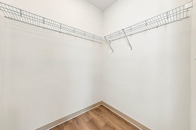 Walk-in closet with wire shelving on two walls. - 409-1529 Oxford Street, North Vancouver