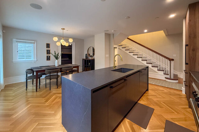 Kitchen island looking across the dining area to the staircase. - North Vancouver