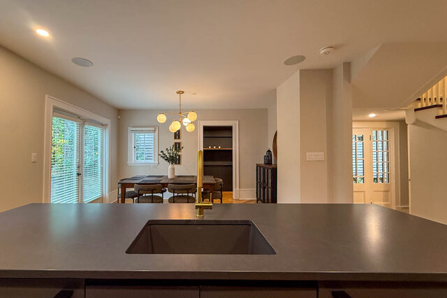 From the island sink, looking across to the dining area and the side entry doors. - North Vancouver