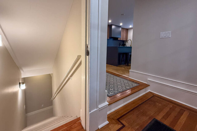 Stairs down to the basement, beside the kitchen. - North Vancouver